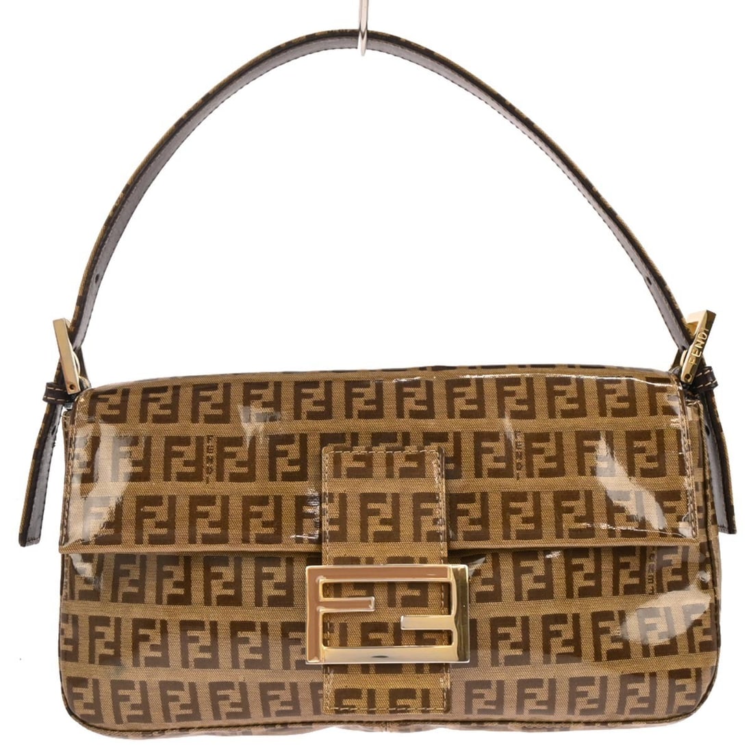 Fendi Zucchino Brown PVC Baguette Shoulder Bag with Gold Tone Hardware: Fendi Zucchino Brown PVC Baguette Shoulder Bag with Gold Tone Hardware This Fendi Baguette handbag features the signature brown Zucchino pattern crafted from durable vinyl with gold tone hardware acce