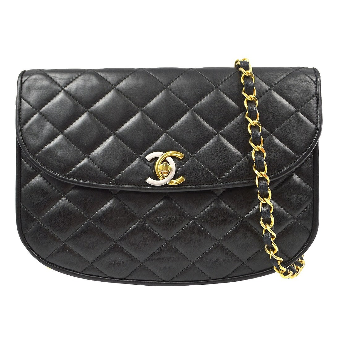 Black Lambskin Leather Round Flap Chanel Bag Vintage Style: Black Lambskin Leather Round Flap Chanel Bag Vintage Style The Chanel Vintage Round Flap Bag is crafted from black quilted lambskin leather, designed for female use. This classic piece features a comp