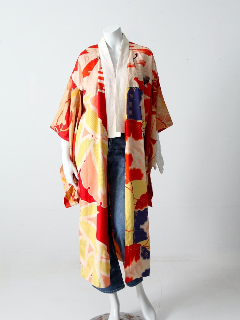 Vintage Floral Kimono Red Yellow Blue Peach Mid-Calf: Vintage Floral Kimono Red Yellow Blue Peach Mid-Calf This vintage kimono is a stunning piece from our Stylist Collection, showcasing a vibrant floral and fan design in red, yellow, blue, and peach. Th