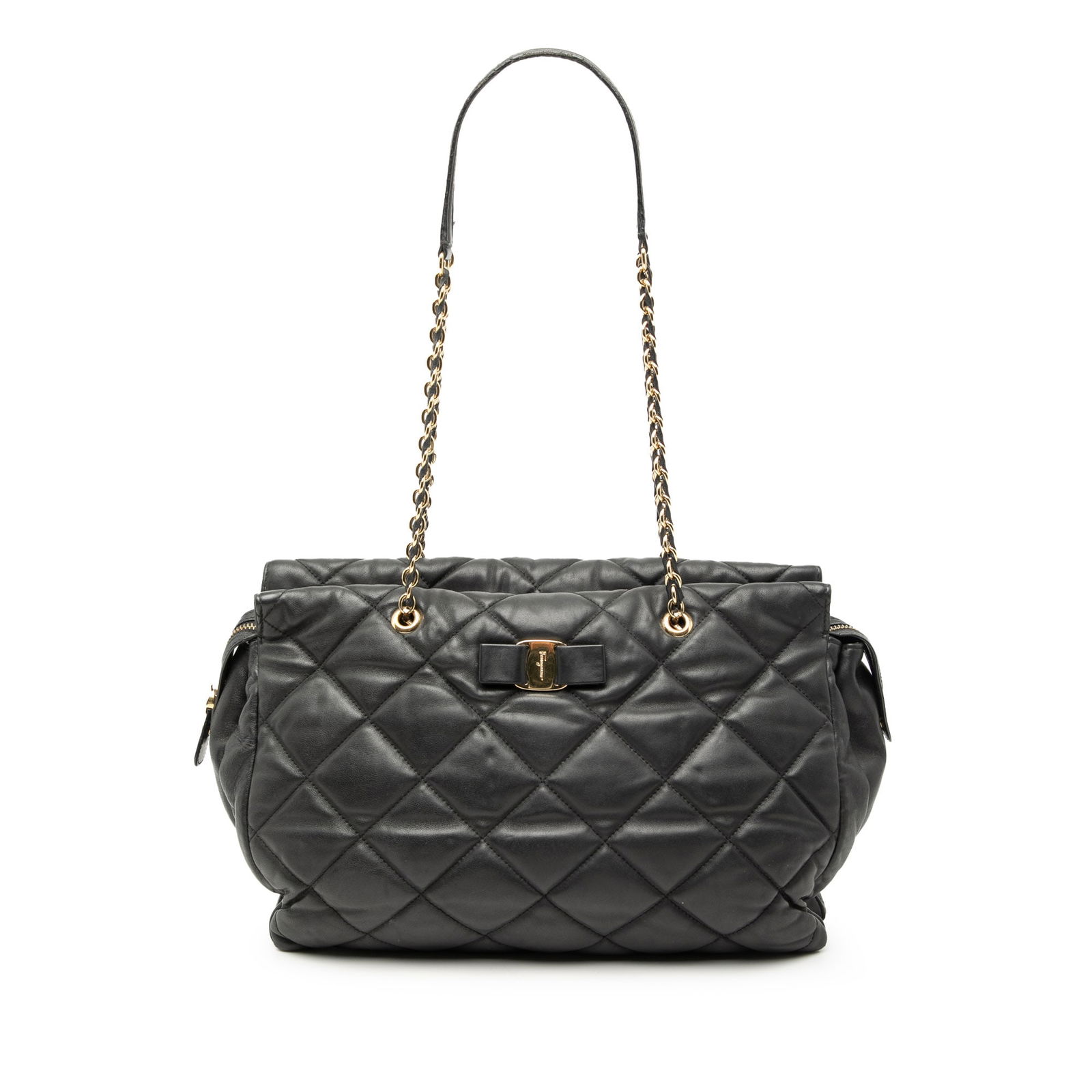Quilted Nappa Leather Vara Tote Bag by Ferragamo: Quilted Nappa Leather Vara Tote Bag by Ferragamo This large tote bag showcases a quilted nappa leather exterior in black, complemented by leather-woven chain link straps with a leather guard. It featu