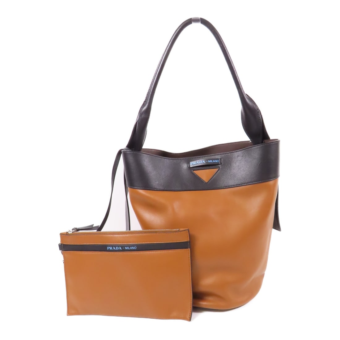 PRADA Ouverture Brown Leather Bucket Shoulder Bag Italy: PRADA Ouverture Brown Leather Bucket Shoulder Bag Italy This Prada Ouverture bucket shoulder bag is crafted from brown leather with black accents. It features a regular size and a stylish bucket silho