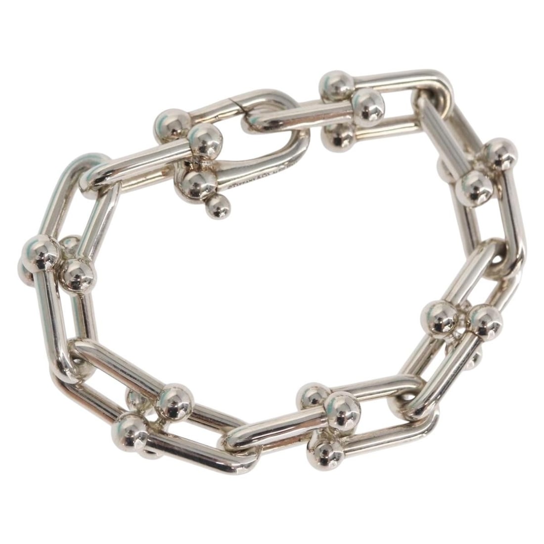 TIFFANY&Co. Large Ag925 Silver Bracelet with Dust Bag: TIFFANY&Co. Large Ag925 Silver Bracelet with Dust Bag This stunning Tiffany & Co. large hardware bracelet is crafted from high-quality Ag925 silver, showcasing the brand's signature elegance and craft