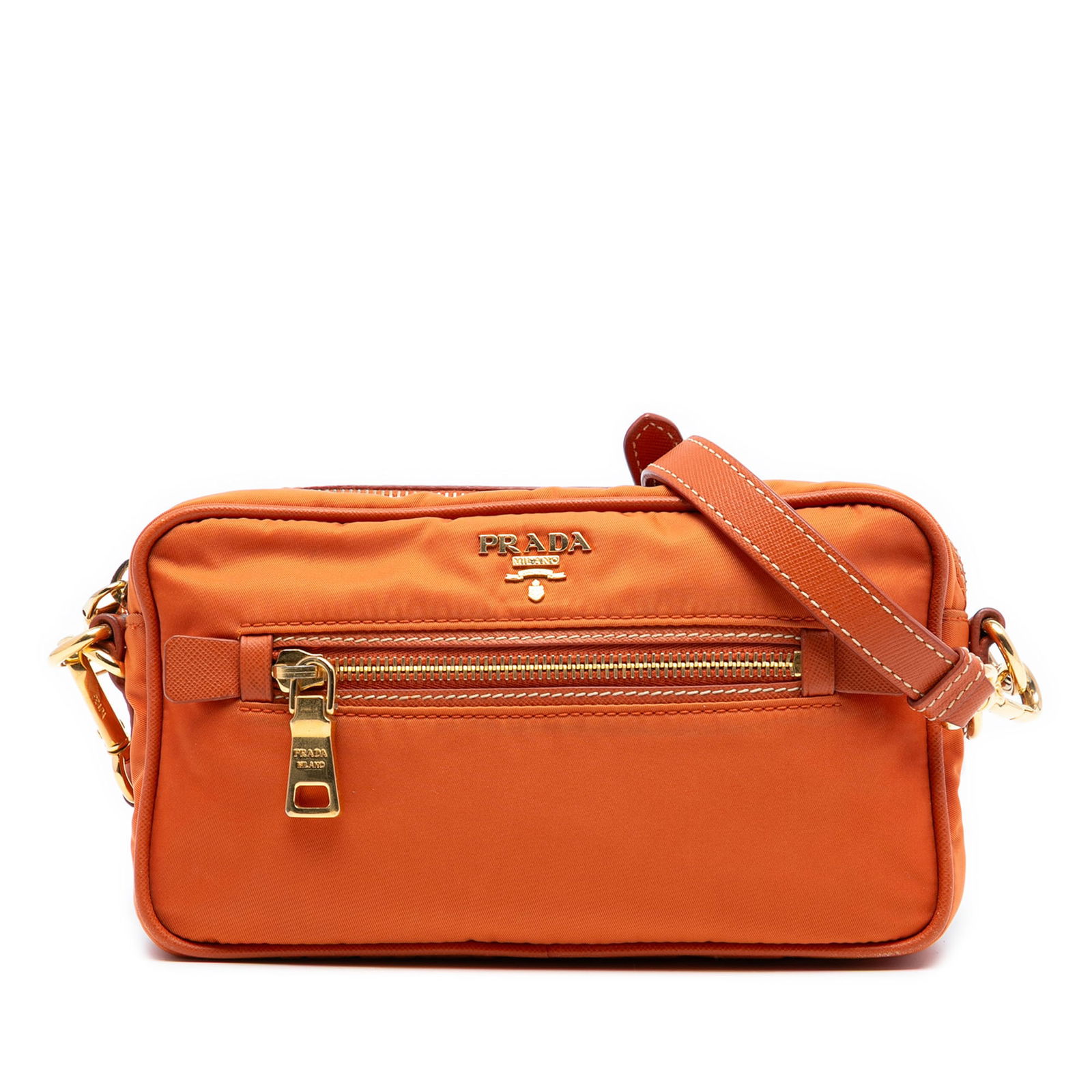 Prada Tessuto Orange Nylon Camera Crossbody with Front Zip Pocket: Prada Tessuto Orange Nylon Camera Crossbody with Front Zip Pocket This Prada Small Tessuto Front Pocket Camera Bag features an orange fabric exterior with a front zip pocket, a top zip closure, and bo