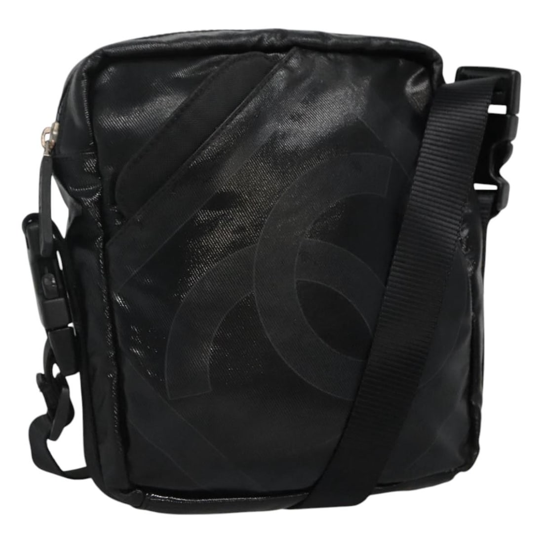 Black Canvas Shoulder Bag by Chanel Sports Collection: Black Canvas Shoulder Bag by Chanel Sports Collection This pre-owned Chanel sports shoulder bag for women features a black canvas exterior with a subtle Coco mark design. Crafted in Italy, the bag mea
