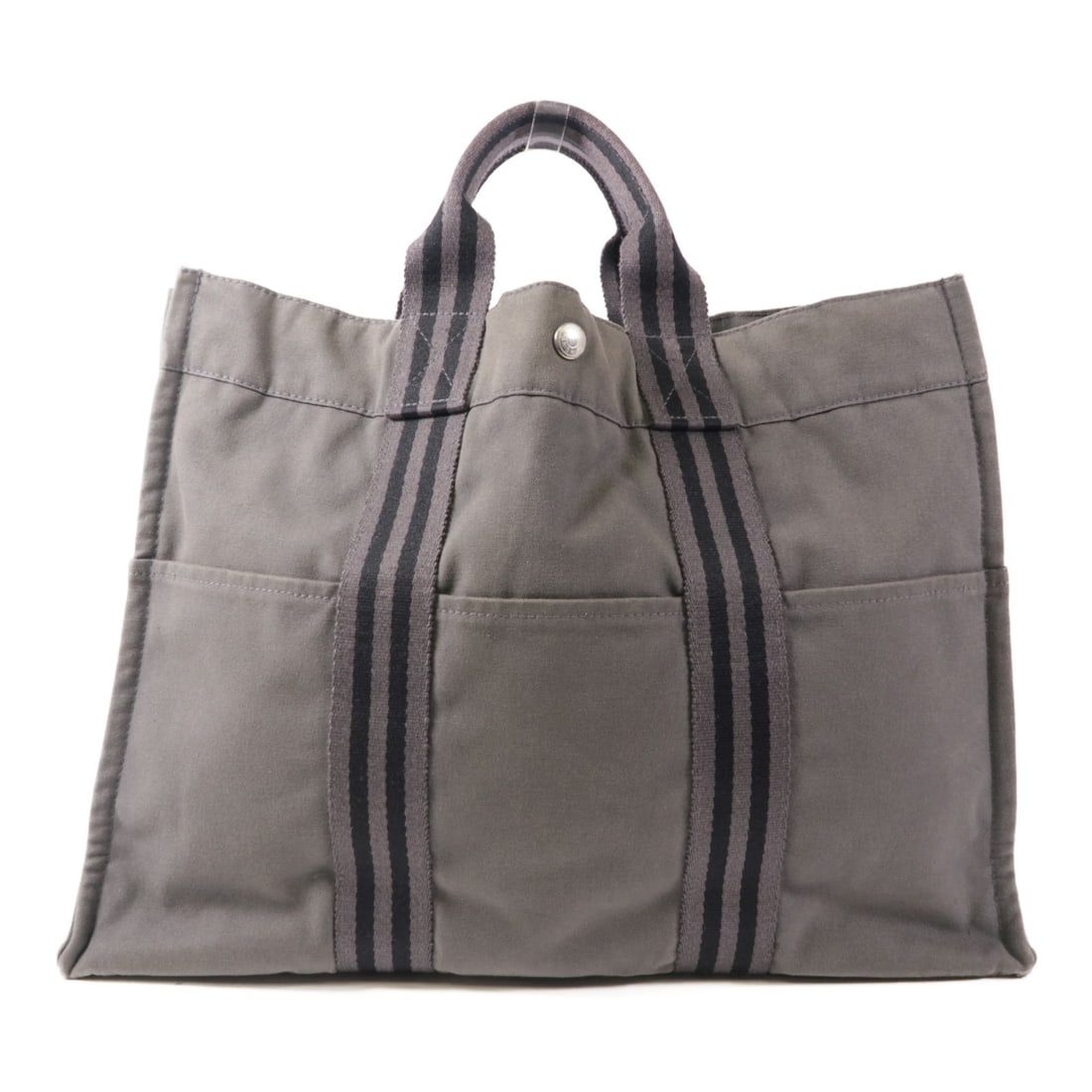 HERMES Classic Hang Bag Canvas Gray PHW 16.5" x 11.8": HERMES Classic Hang Bag Canvas Gray PHW 16.5" x 11.8" Introducing the classic HERMES handbag, expertly crafted from durable gray canvas. This stylish accessory features a spacious interior and a sleek