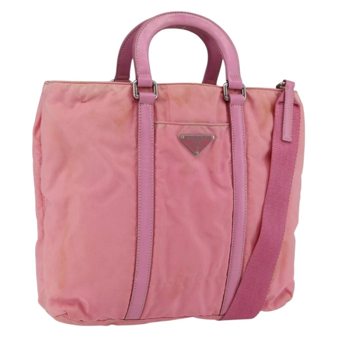 Pink Silver Prada Nylon Handbag with Shoulder Strap Made in Italy: Pink Silver Prada Nylon Handbag with Shoulder Strap Made in Italy This PRADA handbag features a pink nylon exterior with silver-tone metal fittings. It includes a shoulder strap and a handle, both sho
