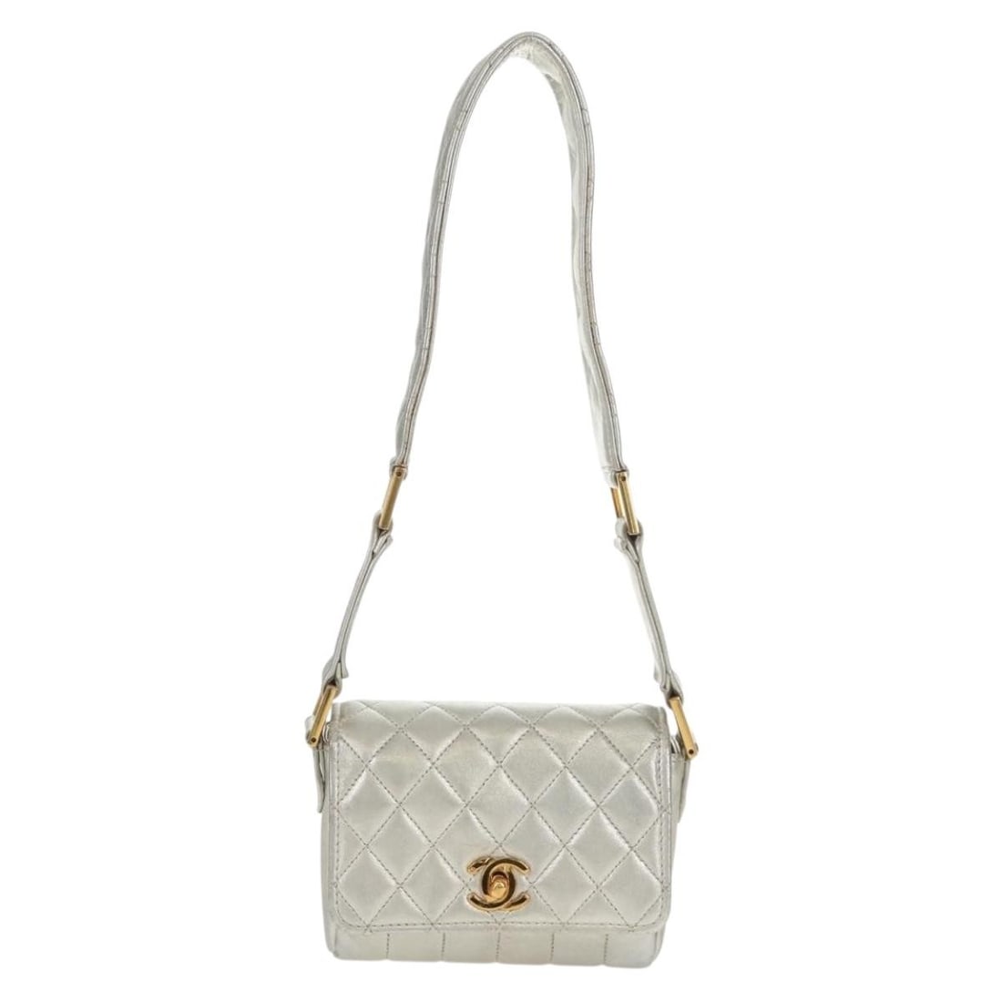 Silver Quilted Leather Flap Shoulder Bag by Chanel Vintage: Silver Quilted Leather Flap Shoulder Bag by Chanel Vintage This Chanel Vintage CC Flap Shoulder Bag is crafted from quilted caviar leather in a silver color. Designed for women, it features a classic