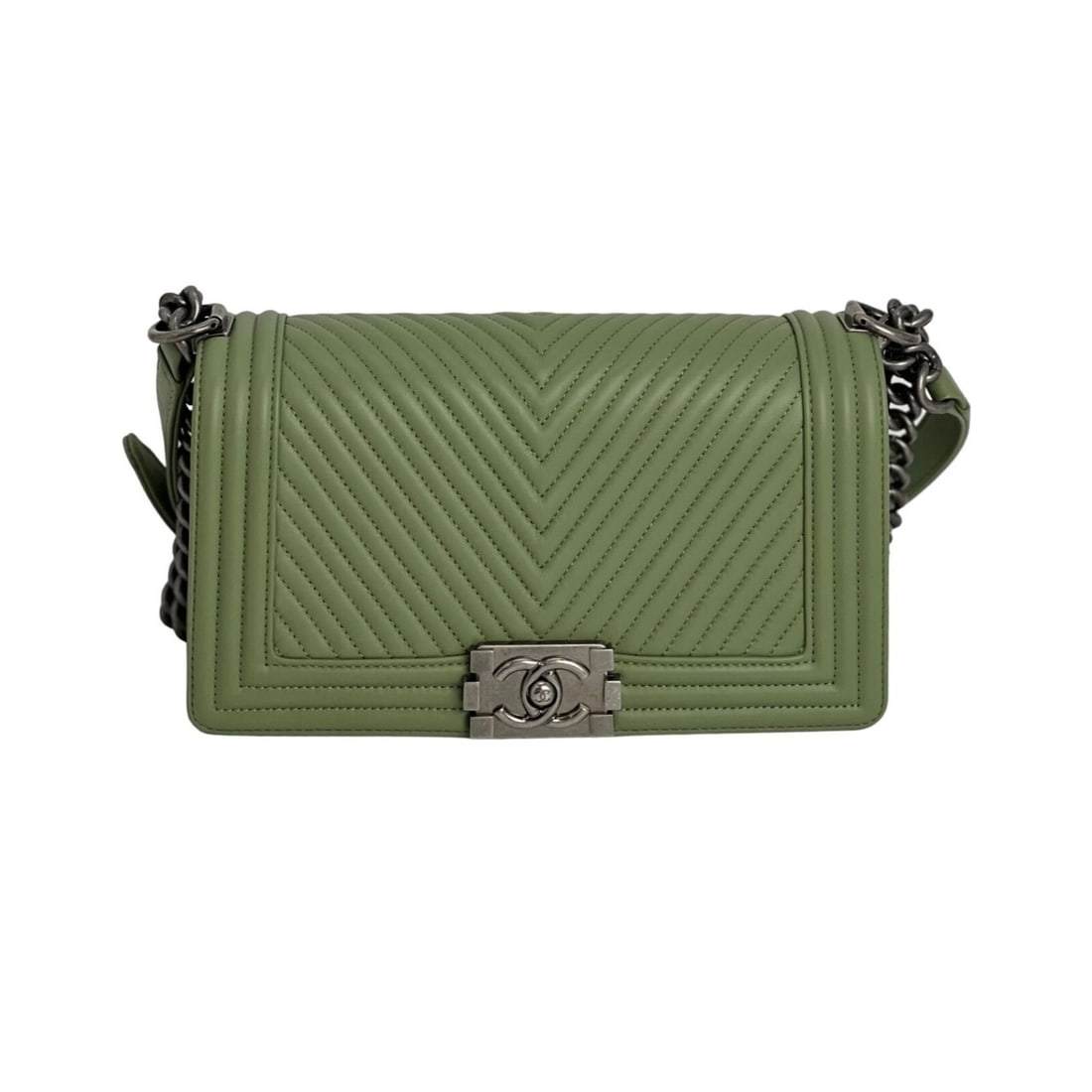 Chanel Light Green Chevron Quilted Boy Flap Bag with Gunmetal Hardware: Chanel Light Green Chevron Quilted Boy Flap Bag with Gunmetal Hardware Elevate your accessory collection with this stunning Chanel Calfskin Chevron Quilted Medium Boy Flap Bag in a delightful light gr