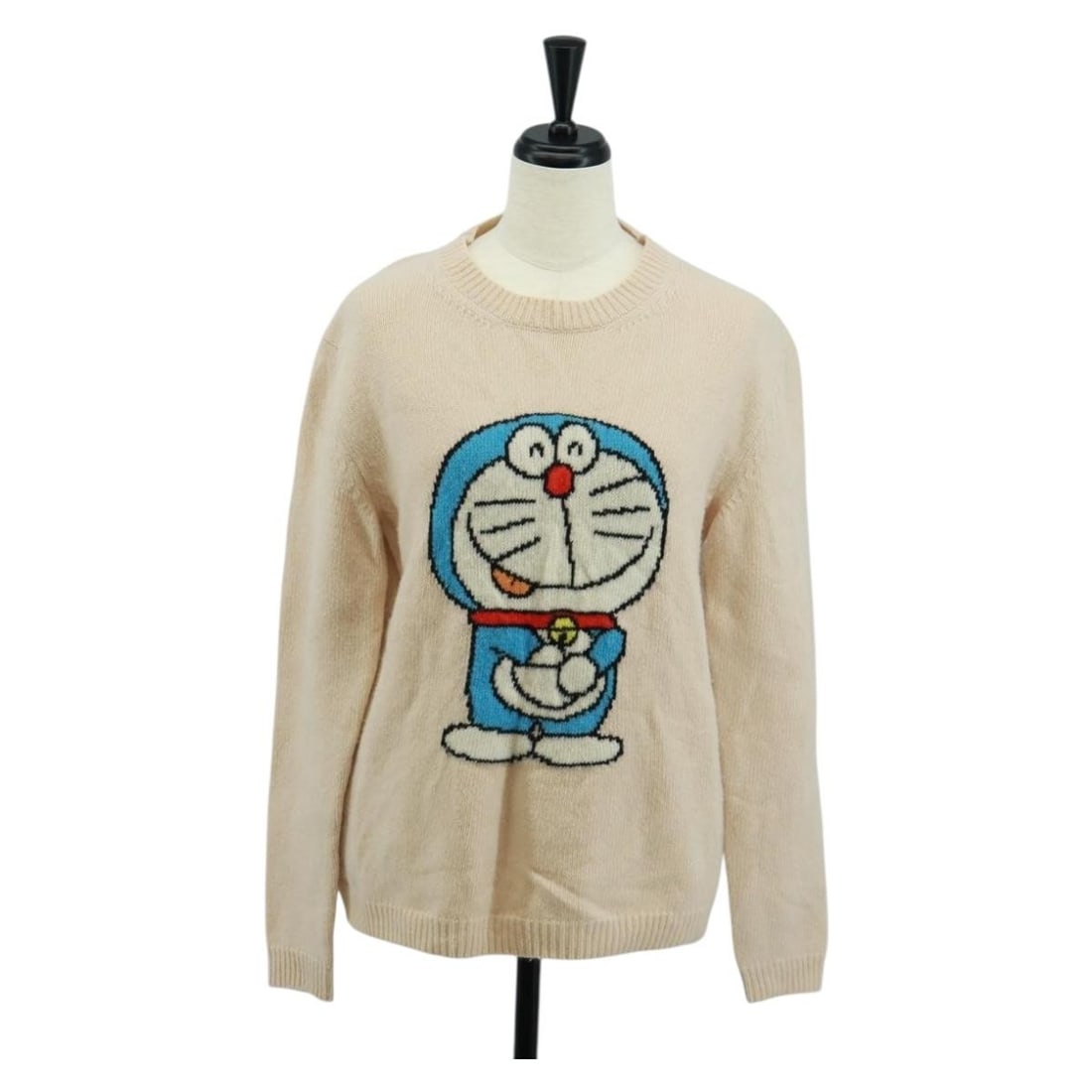 Ivory Wool Jacket by Gucci Italy: Ivory Wool Jacket by Gucci Italy This GUCCI ivory sweater is crafted from wool and features a classic jacket style. Made in Italy, it offers a refined look with a back length of approximately 23.6 inc