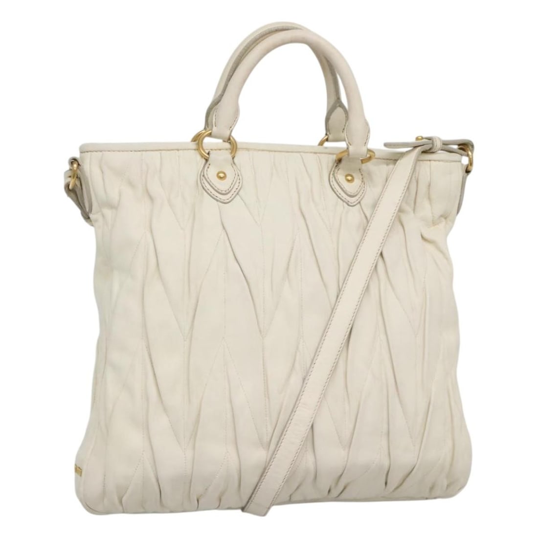 Miu Miu White Leather Vintage Tote Handbag for Women: Miu Miu White Leather Vintage Tote Handbag for Women This Miu Miu vintage tote bag is crafted from white leather and features a spacious design. It is designed for women and includes both handles and