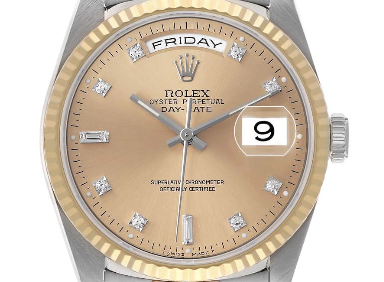 Rolex Day-Date Ref 18239BIC Champagne Diamond Dial Aftermarket Leather Band: Rolex Day-Date Ref 18239BIC Champagne Diamond Dial Aftermarket Leather Band This Rolex Day-Date features a champagne diamond factory dial, complemented by a fluted yellow gold bezel and an aftermarket