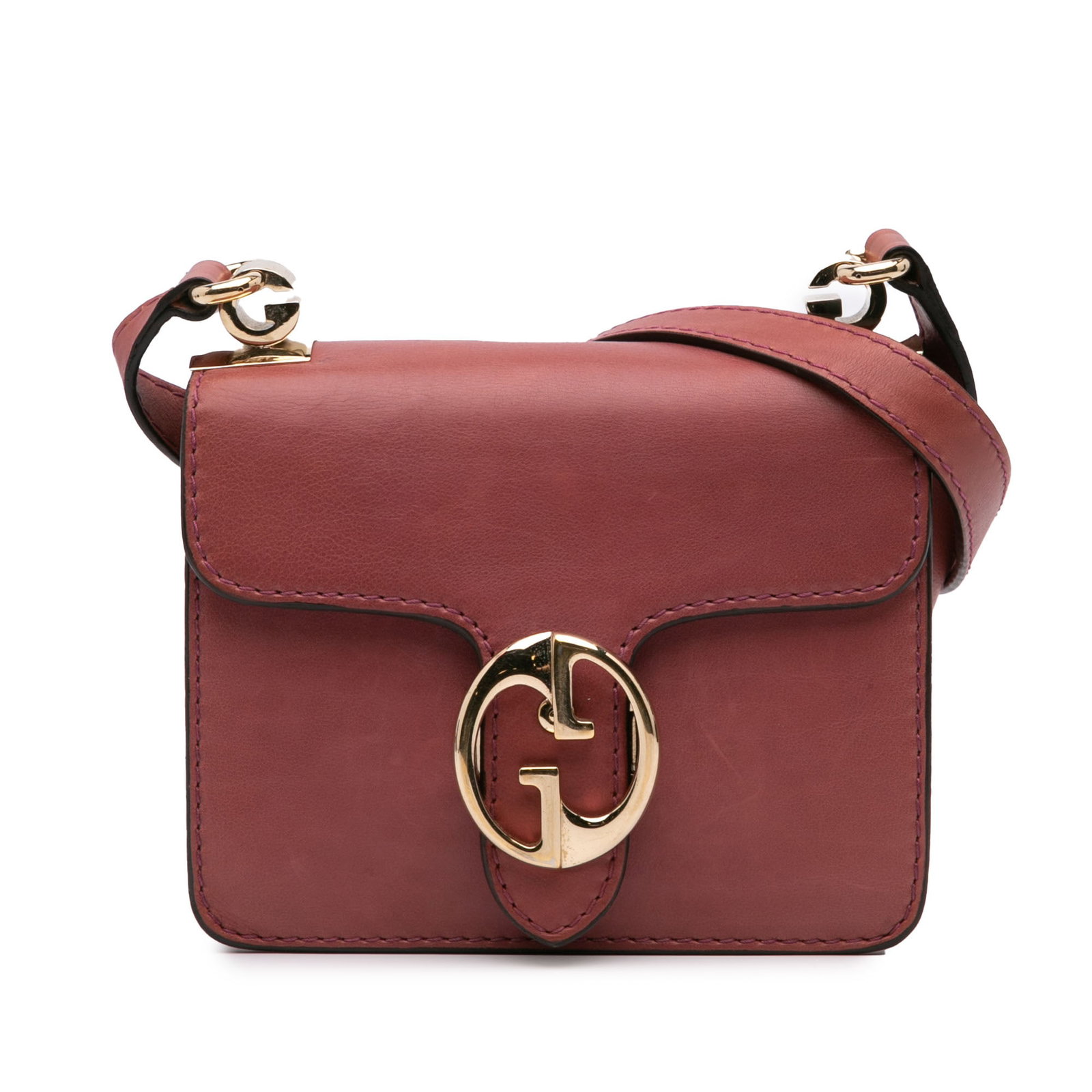 Gucci Red Leather Small 1973 Crossbody Bag with Gold Double G: Gucci Red Leather Small 1973 Crossbody Bag with Gold Double G This Gucci Small Leather 1973 Crossbody Bag is a stylish accessory crafted from high-quality leather. It features an adjustable flat leath