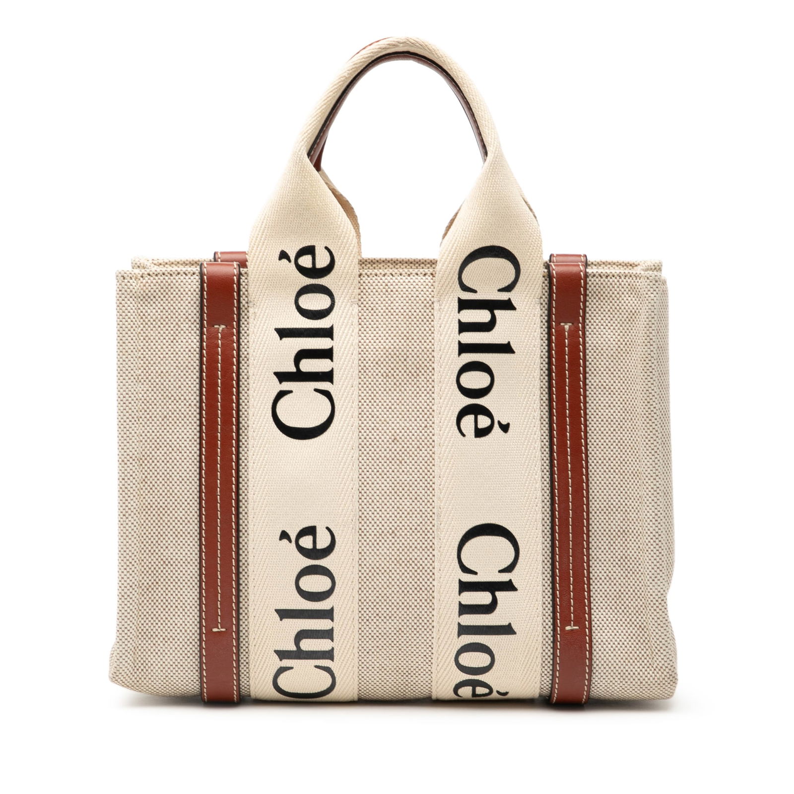 Chloe Woody Small Brown Canvas Tote with Leather Trim: Chloe Woody Small Brown Canvas Tote with Leather Trim This Chloe Small Canvas Woody Tote is crafted with a canvas body accented by leather trim and features flat canvas handles with leather detailing.