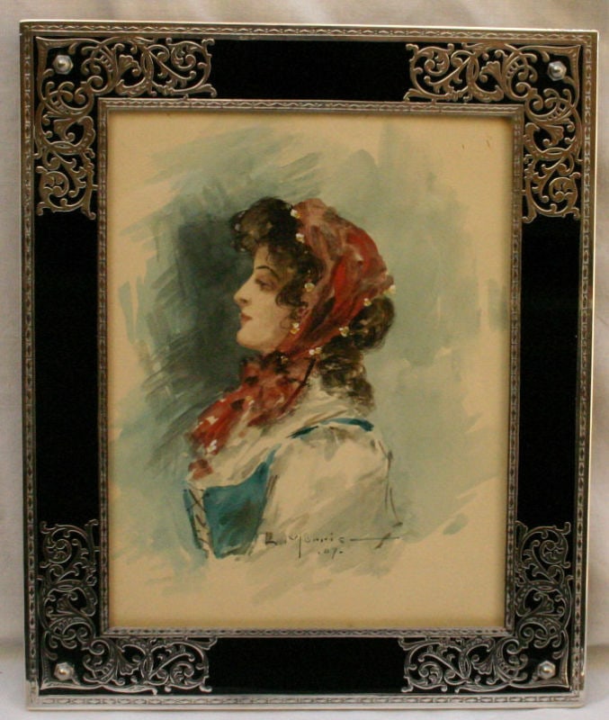 French Art Deco Sterling Silver Frame with Watercolor by L. Morris: French Art Deco Sterling Silver Frame with Watercolor by L. Morris This exquisite French Art Deco picture frame features a stunning sterling silver design complemented by black glass. Crafted with exc