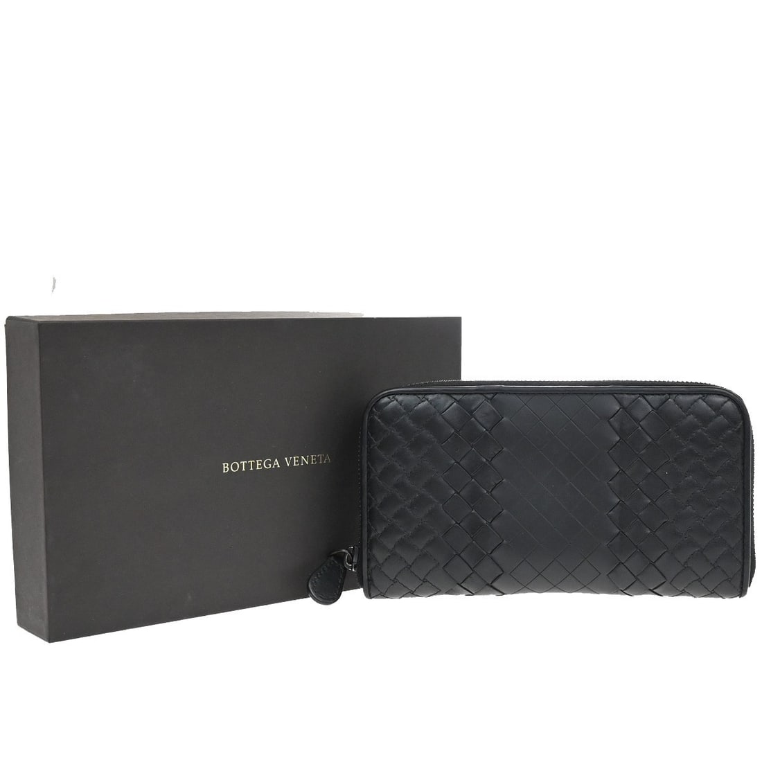 Intrecciato Leather Zip Wallet by Bottega Veneta in Black: Intrecciato Leather Zip Wallet by Bottega Veneta in Black This Bottega Veneta Intrecciato Long Zip Wallet is crafted from black leather and features the signature woven design. Designed for women, it