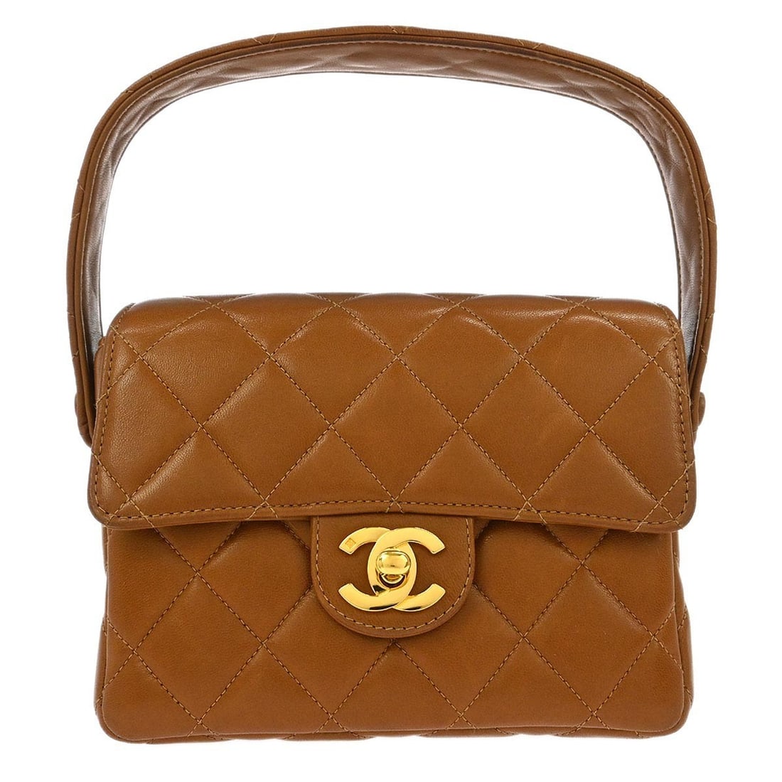 Mini Classic Flap Top Handle Bag in Brown Lambskin Leather by Chanel: Mini Classic Flap Top Handle Bag in Brown Lambskin Leather by Chanel This Chanel Classic Flap mini handbag features a brown leather exterior and a top handle design. Crafted in France, it is styled wi