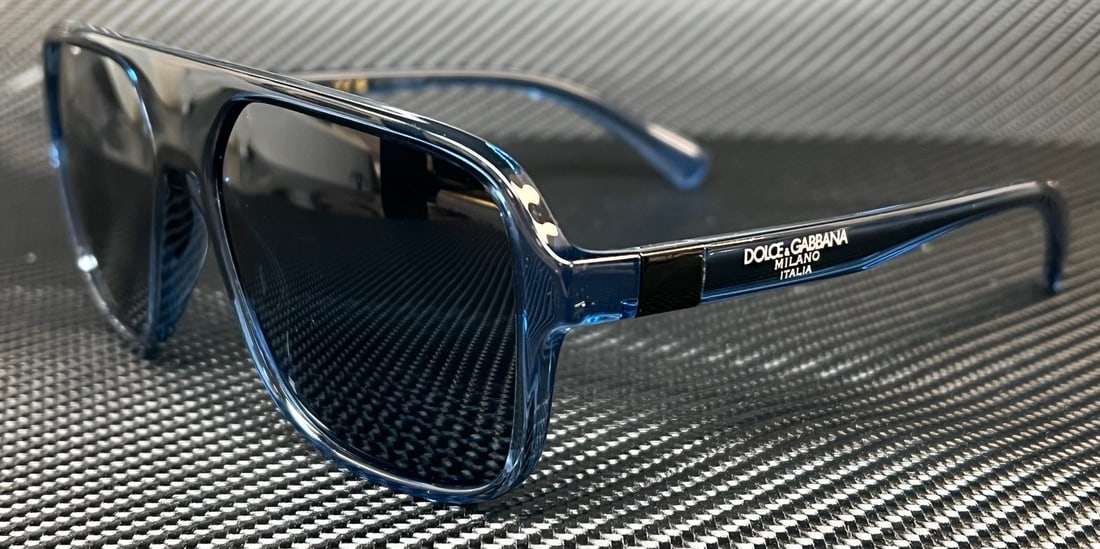 Dolce & Gabbana DG6134 Transparent Blue Square Sunglasses UV400: Dolce & Gabbana DG6134 Transparent Blue Square Sunglasses UV400 Elevate your style with these Dolce & Gabbana DG6134 sunglasses, featuring a striking transparent blue square frame. Designed for the mo