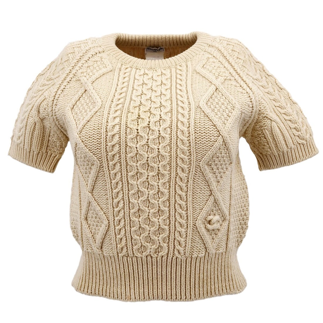Chanel Ivory Wool Short Sleeve Knit Top 96A Size 38: Chanel Ivory Wool Short Sleeve Knit Top 96A Size 38 Elevate your casual wardrobe with this Chanel short sleeve sweater knit top. Featuring a classic round neckline and crafted from 100% wool, this ivo