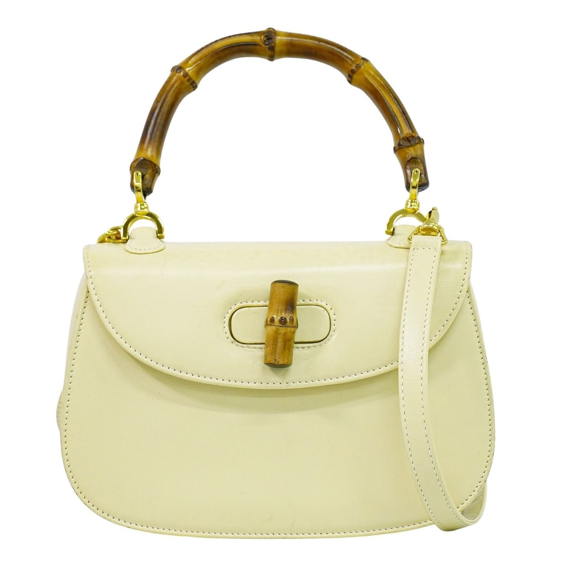Beige Leather Gucci Vintage Convertible Bamboo Handle Bag Italy: Beige Leather Gucci Vintage Convertible Bamboo Handle Bag Italy This Gucci Vintage Convertible Bamboo Top Handle Bag is crafted from beige leather and features a distinctive bamboo top handle. Designe