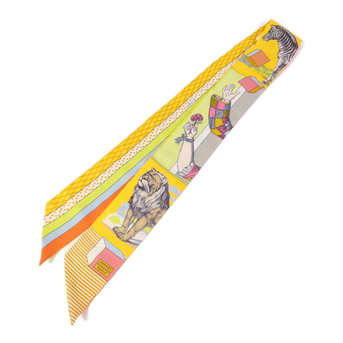 HERMES Multicolor Silk Twilly Scarf Made in France: HERMES Multicolor Silk Twilly Scarf Made in France Elevate your accessory collection with this exquisite HERMES Twilly Scarf. Crafted from luxurious silk, this multicolor scarf adds a vibrant touch to