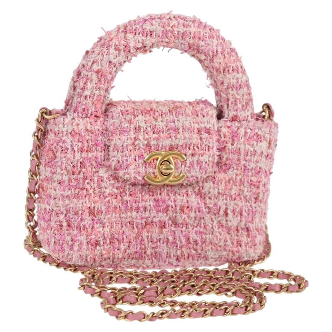 Chanel Pink Tweed Kelly Top Handle Shopping Bag with Quilted Design: Chanel Pink Tweed Kelly Top Handle Shopping Bag with Quilted Design This Chanel Kelly Top Handle Shopping Bag features a quilted tweed exterior in pink, designed for women. The bag is pre-owned and in