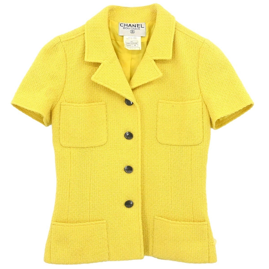 Yellow Wool Nylon Mid-Length Jacket Chanel 97C Size 38: Yellow Wool Nylon Mid-Length Jacket Chanel 97C Size 38 This mid-length Chanel single breasted jacket is crafted from a blend of 96% wool and 4% nylon in a vibrant yellow color. The jacket features but