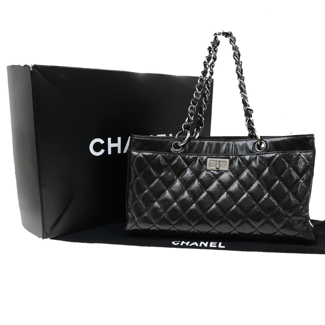 Black Patent Leather Chanel Reissue 2.55 Tote Bag 35cm: Black Patent Leather Chanel Reissue 2.55 Tote Bag 35cm This Chanel Reissue 2.55 Tote is crafted from black patent leather and designed for women. The bag features the classic quilted pattern and measu