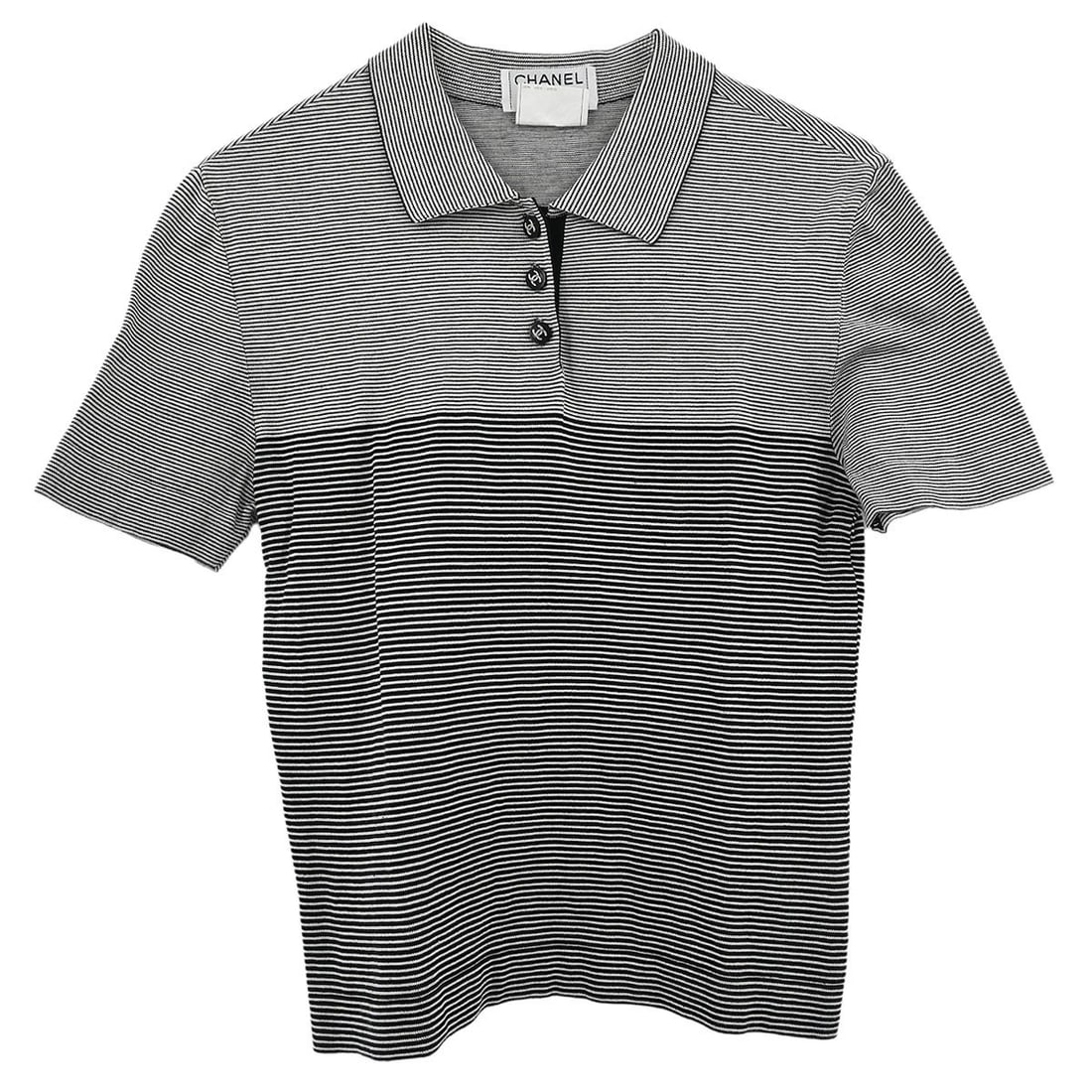 Chanel Vintage Black Cotton Short Sleeve Top Size 38: Chanel Vintage Black Cotton Short Sleeve Top Size 38 Elevate your casual wardrobe with this vintage Chanel short sleeve top. Crafted from 100% cotton, this stylish black top features a collared neckli