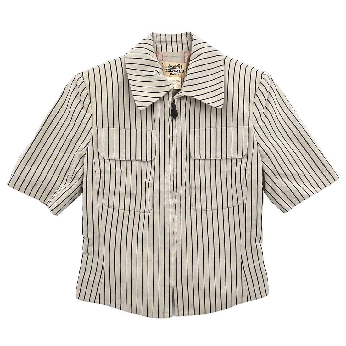 Beige Hermes Short Sleeve Zip Jacket Size 36 Vintage: Beige Hermes Short Sleeve Zip Jacket Size 36 Vintage This Hermes zip-up jacket features a beige outer shell made of 91% cotton and 9% polyester. It is a mid-length, short sleeve jacket designed for ca