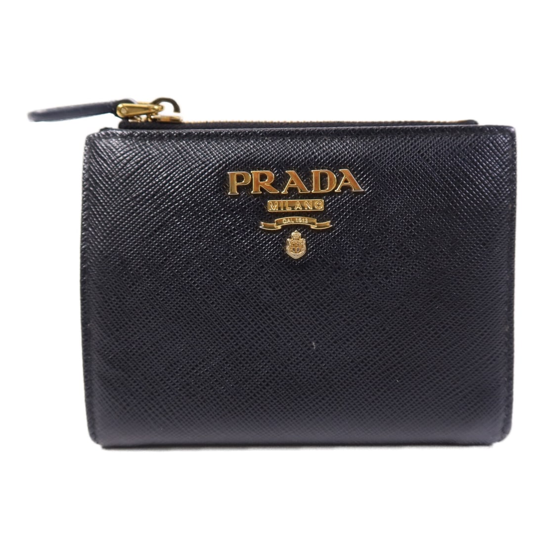 Prada Saffiano Leather Black Bi-fold Wallet with Gold Hardware 1ML023: Prada Saffiano Leather Black Bi-fold Wallet with Gold Hardware 1ML023 This Prada bifold wallet is crafted from durable Saffiano leather in black and features a classic, compact design. Made in Italy,