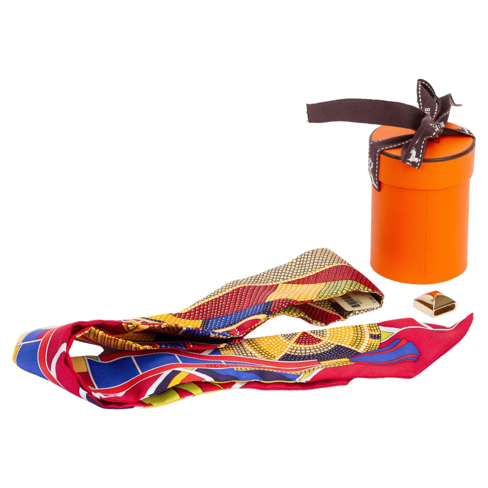 Hermes Geometric Twilly Silk Scarf with Scarf Ring: Hermes Geometric Twilly Silk Scarf with Scarf Ring This exquisite Hermes Geometric Twilly is a stunning accessory that adds a touch of elegance to any outfit. Crafted from luxurious silk, this multico