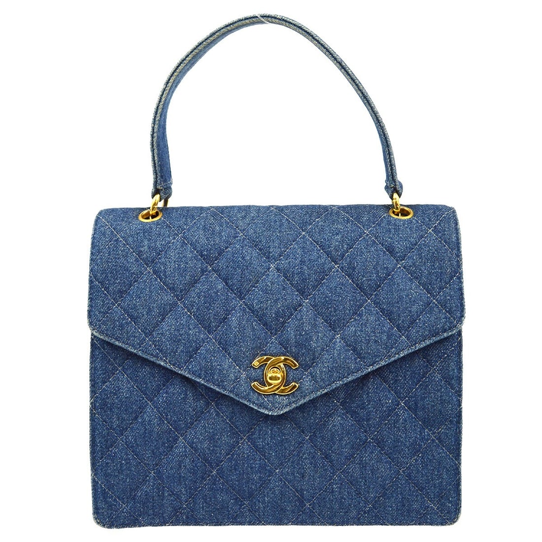 Chanel Indigo Denim Satchel Handbag with CC Logos: Chanel Indigo Denim Satchel Handbag with CC Logos This stylish Chanel Indigo Denim Handbag features a chic flap turnlock closure and is perfect for those seeking a blend of luxury and casual elegance.