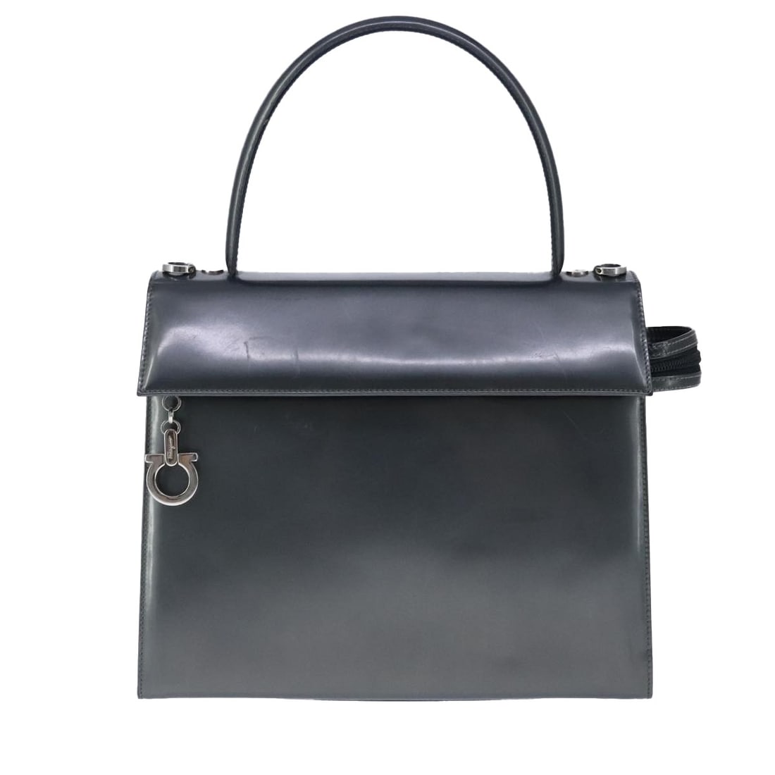 Black Leather Vintage Handbag by Salvatore Ferragamo: Black Leather Vintage Handbag by Salvatore Ferragamo This Salvatore Ferragamo vintage handbag for women features a classic black leather exterior with metal fittings. The bag is crafted in Italy and i