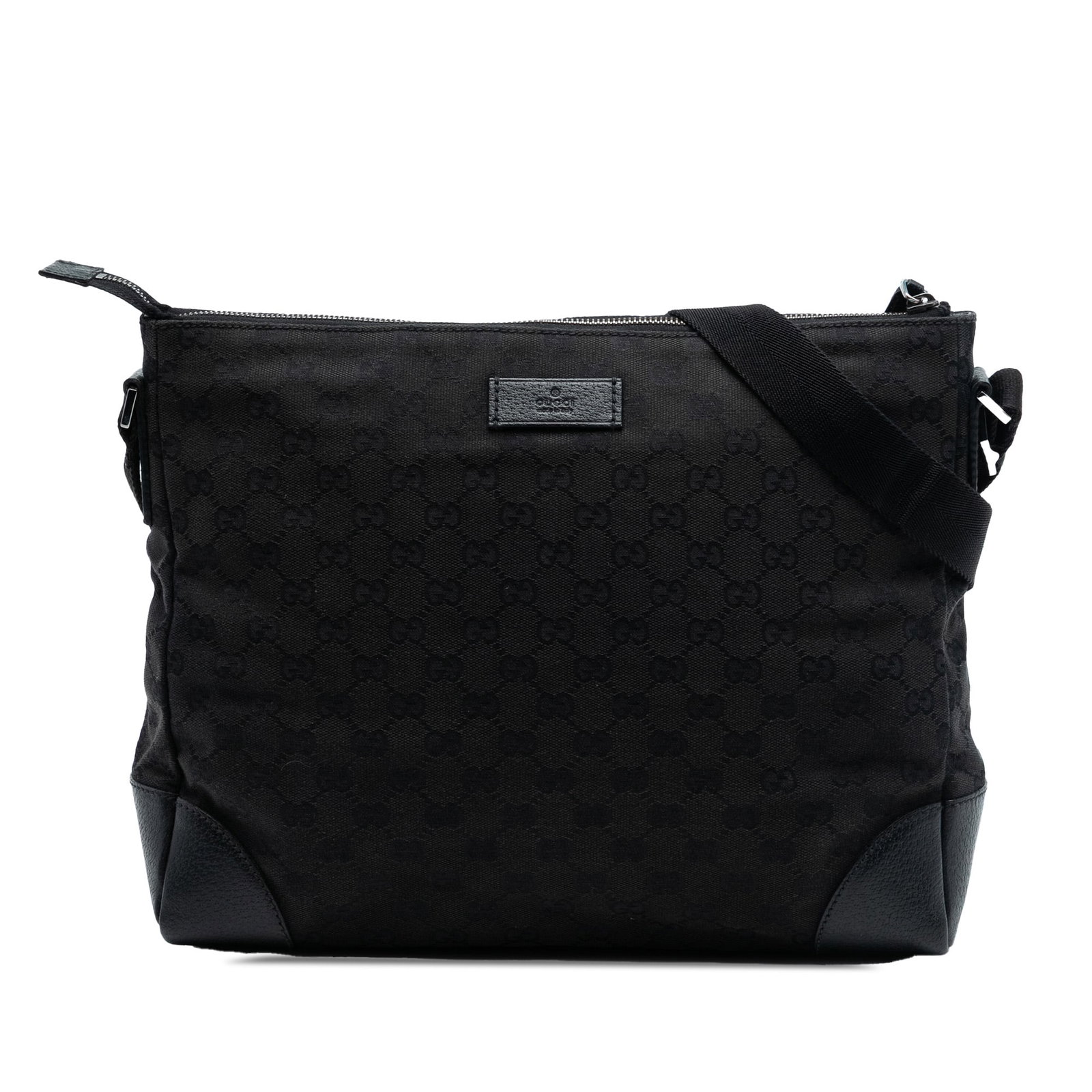 Black GG Canvas Joy Crossbody Bag by Gucci with Leather Trim: Black GG Canvas Joy Crossbody Bag by Gucci with Leather Trim This Gucci GG Canvas Joy Messenger is a crossbody bag crafted from canvas with leather trim. It features a flat canvas strap, a top zip clo