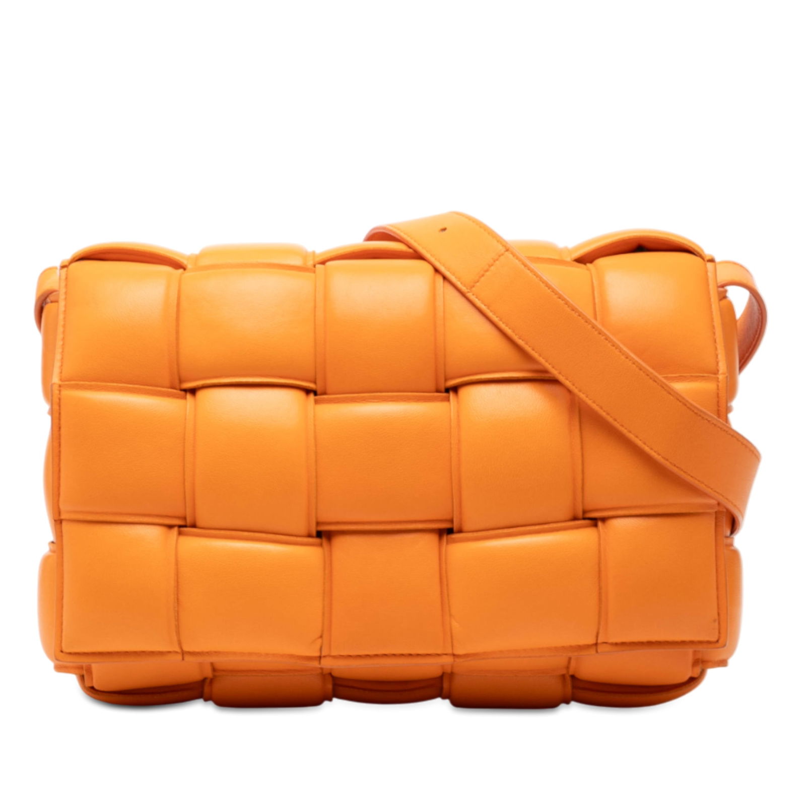 Nappa Intrecciato Padded Cassette Orange Leather Crossbody by Bottega Veneta: Nappa Intrecciato Padded Cassette Orange Leather Crossbody by Bottega Veneta This Bottega Veneta Padded Cassette crossbody bag features the iconic Intrecciato woven nappa leather in orange. It is desi