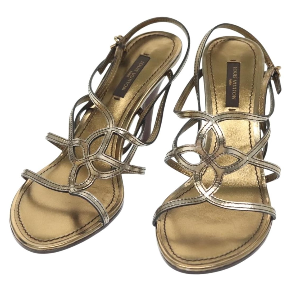 Louis Vuitton Gold Leather High Heel Mules 36.5 Made in Italy: Louis Vuitton Gold Leather High Heel Mules 36.5 Made in Italy Elevate your elegance with these stunning Louis Vuitton high heel mules, crafted from luxurious gold leather. Designed in Italy, these sho