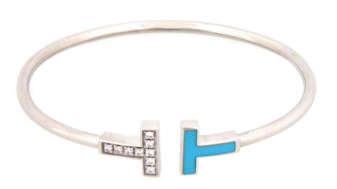 T Wire Cuff Bracelet in 18k White Gold with Diamonds and Turquoise: T Wire Cuff Bracelet in 18k White Gold with Diamonds and Turquoise This Tiffany & Co. T Wire Diamond & Turquoise bangle cuff bracelet is crafted from solid 18k white gold. The bracelet features a slee
