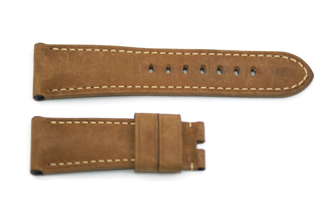 Authentic Panerai Brown Leather Wristwatch Strap 26mm: Authentic Panerai Brown Leather Wristwatch Strap 26mm Enhance your wristwatch with this authentic Panerai Brown Leather Strap. Crafted from high-quality leather, this strap features a width of 26 mm,