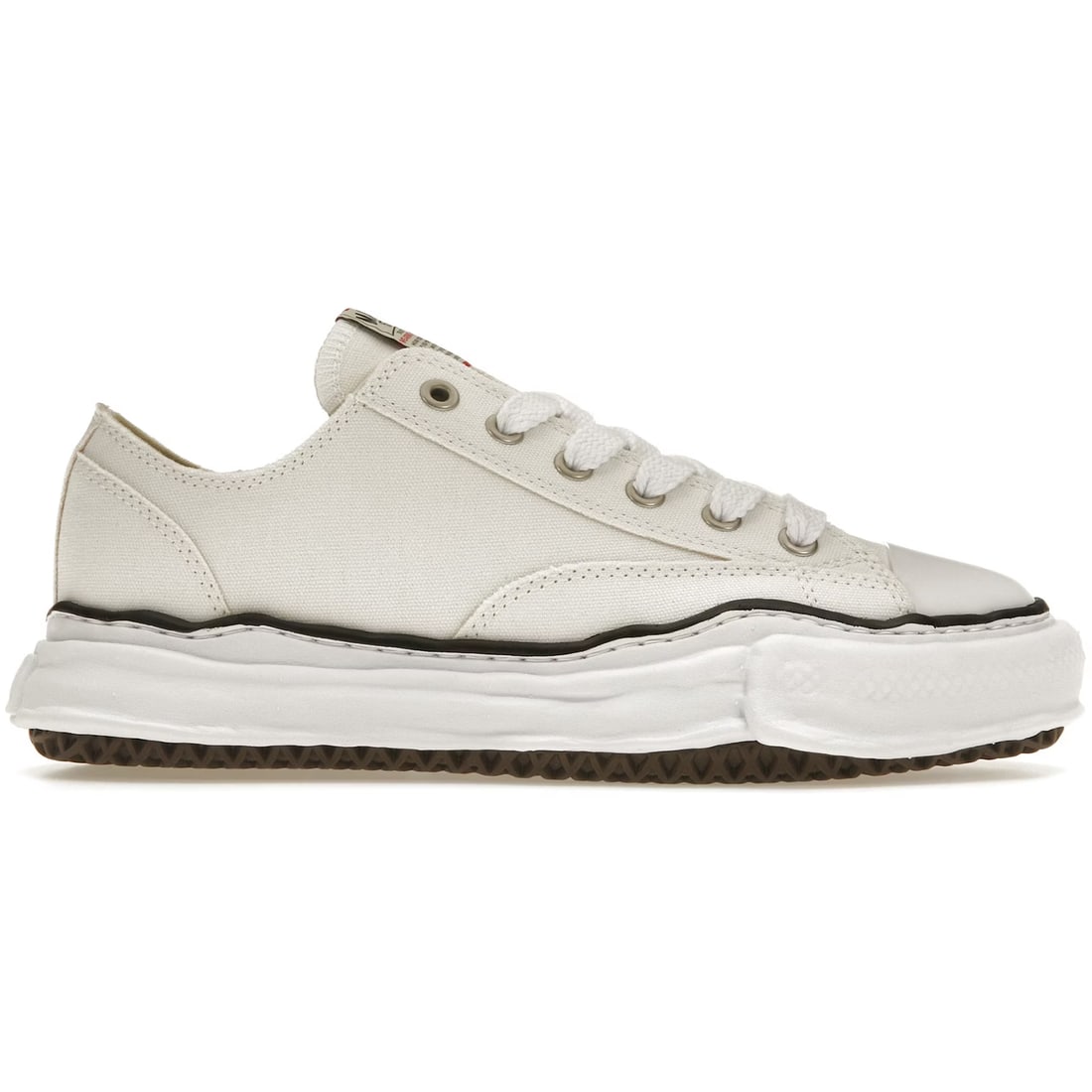 Peterson OG Sole White Canvas Low Sneakers by Maison Mihara Yasuhiro: Peterson OG Sole White Canvas Low Sneakers by Maison Mihara Yasuhiro Maison Mihara Yasuhiro Peterson OG Sole Canvas Low sneakers feature a white canvas upper with the signature OG sole design. These s