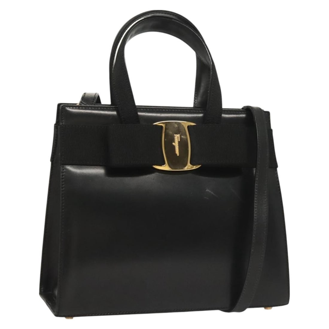 Black Leather Vara Bow Tote by Salvatore Ferragamo Convertible Design: Black Leather Vara Bow Tote by Salvatore Ferragamo Convertible Design This Salvatore Ferragamo Convertible Vara Bow Tote is crafted from black leather and designed for women. The tote features the sig
