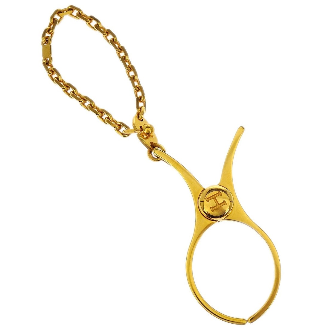 Gold Plated Filou Glove Clip Small by Hermes: Gold Plated Filou Glove Clip Small by Hermes This is a Hermes Filou glove holder clip in a small size, crafted from gold-plated material. The clip features a gold color and is made in France. It is in