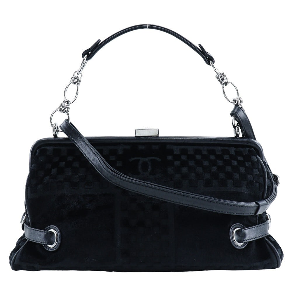 Chanel Black Velvet Vintage Bowler Bag with CC Side Belt: Chanel Black Velvet Vintage Bowler Bag with CC Side Belt This vintage Chanel CC side belted bowler bag features a check embossed black velvet exterior. Designed for women, it combines classic style wi