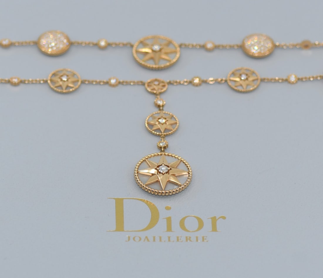 Dior Rose de Vents 18k Rose Gold Diamond Necklace with Box and Certificate: Dior Rose de Vents 18k Rose Gold Diamond Necklace with Box and Certificate This Dior Rose Des Vents necklace features a chain design crafted from 18k rose gold and is adorned with diamonds. The neckla