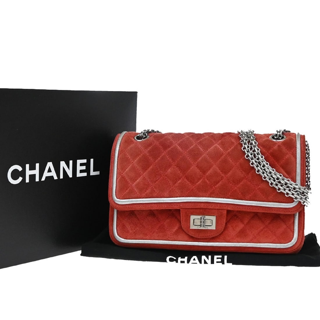 Red quilted suede Chanel Reissue 2.55 double flap shoulder bag with metallic calfskin: Red quilted suede Chanel Reissue 2.55 double flap shoulder bag with metallic calfskin The Chanel Reissue 2.55 Flap Bag features a signature quilted suede exterior with metallic calfskin accents. Desig
