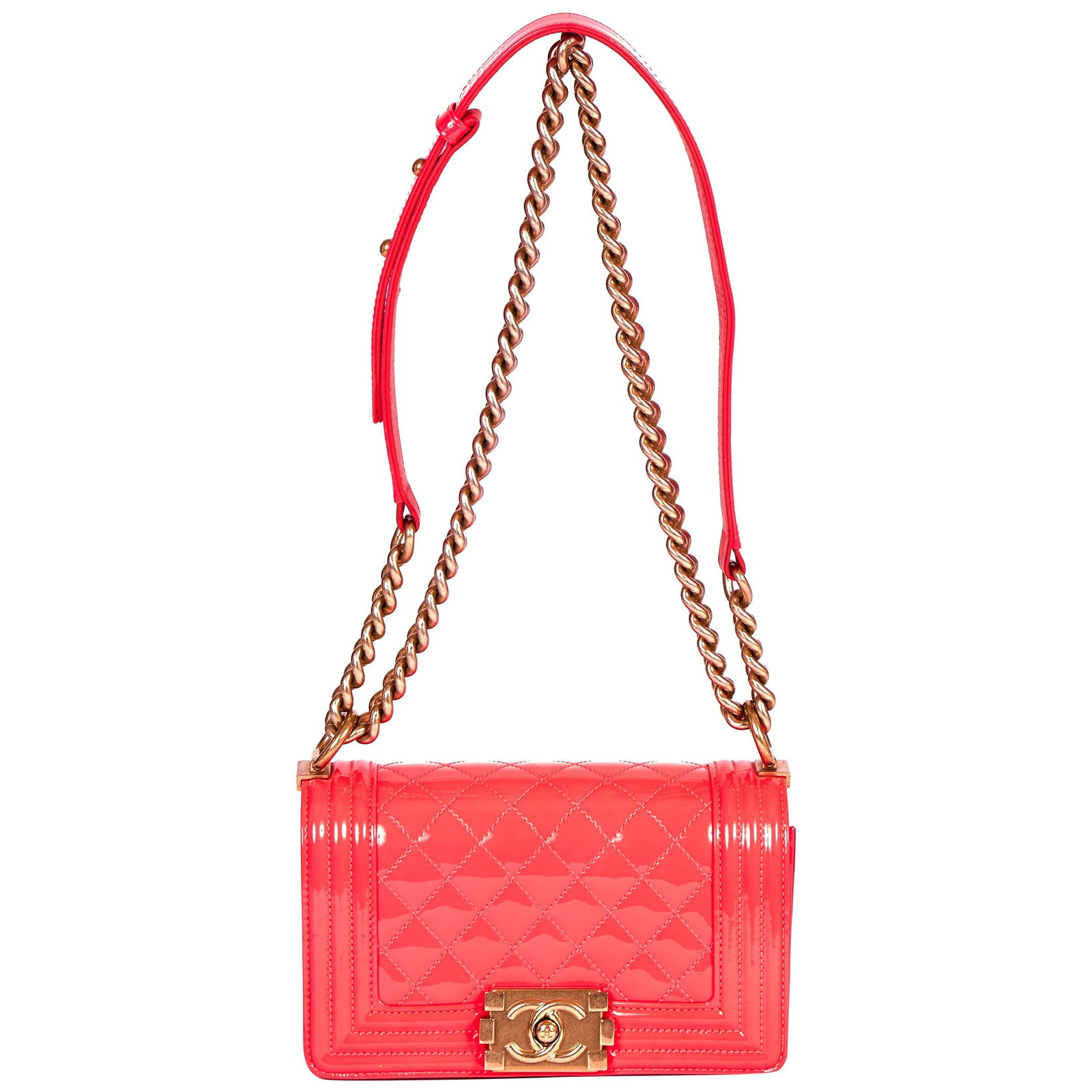 Chanel Fluorescent Pink Patent Boy Bag with Gold Chain: Chanel Fluorescent Pink Patent Boy Bag with Gold Chain This exquisite Chanel Boy Bag showcases a vibrant fluorescent patent pink finish, perfect for making a bold fashion statement. Crafted in France