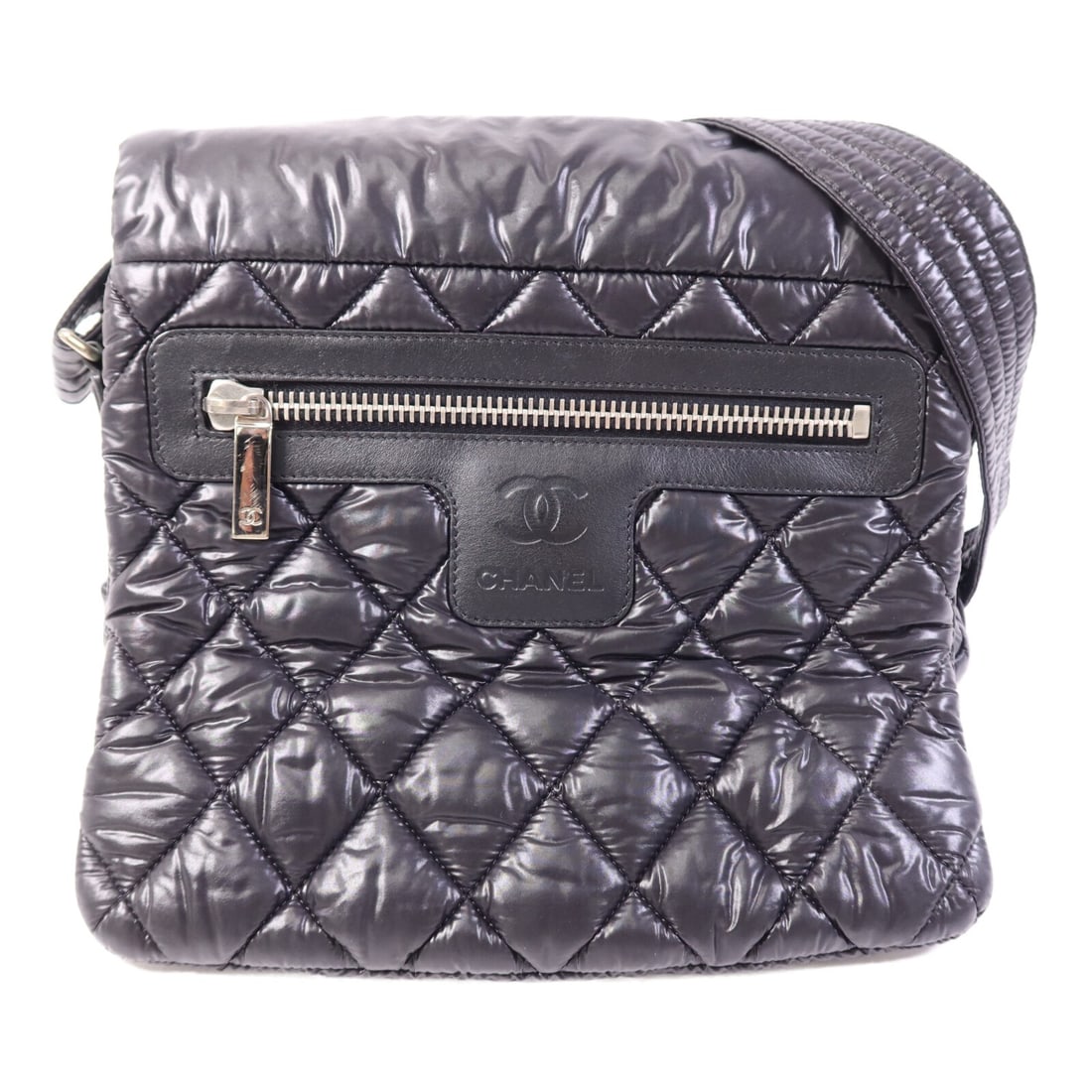 Navy Nylon Coco Cocoon Shoulder Bag by CHANEL with Silver Hardware: Navy Nylon Coco Cocoon Shoulder Bag by CHANEL with Silver Hardware This CHANEL CC Coco Cocoon shoulder bag features a navy nylon exterior with a sleek and contemporary design. Crafted in France, it of