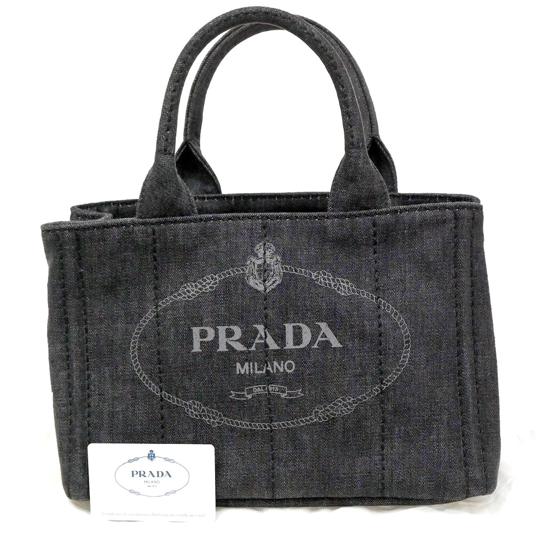 Denim Prada Canapa Convertible Women's Tote Bag 29cm x 18cm x 14cm: Denim Prada Canapa Convertible Women's Tote Bag 29cm x 18cm x 14cm This Prada Canapa Convertible Tote for women features a black denim exterior. Designed for versatile use, it offers a convertible sty