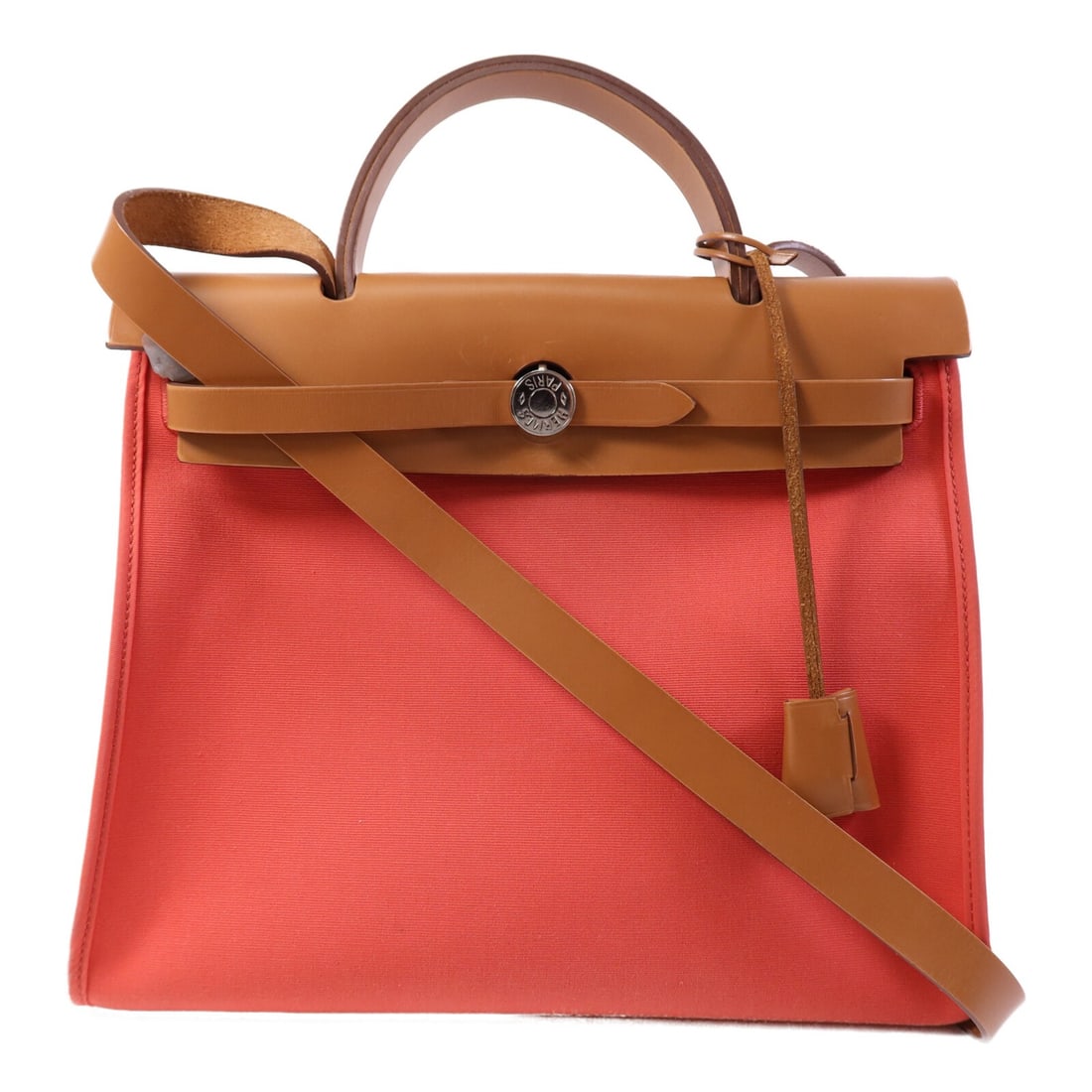 Herbag PM Orange Canvas 2-Way Shoulder Bag with Palladium Hardware: Herbag PM Orange Canvas 2-Way Shoulder Bag with Palladium Hardware This Hermes Herbag PM 2-way shoulder bag features a vibrant orange canvas exterior with palladium hardware. Designed for versatility,