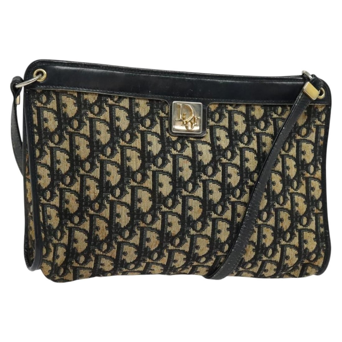 Navy Canvas Dior Trotter Vintage Shoulder Bag from France: Navy Canvas Dior Trotter Vintage Shoulder Bag from France This Christian Dior Vintage Trotter Shoulder Bag features navy canvas and is designed for women. The bag was crafted in France and displays th