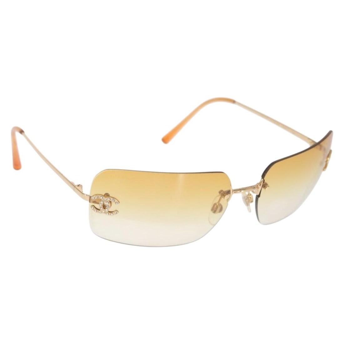 Orange Metal CHANEL Sunglasses with CC Logo and Original Case: Orange Metal CHANEL Sunglasses with CC Logo and Original Case These CHANEL sunglasses feature a stylish orange metal frame and are crafted in Italy. The sunglasses come with an item box and a sunglass